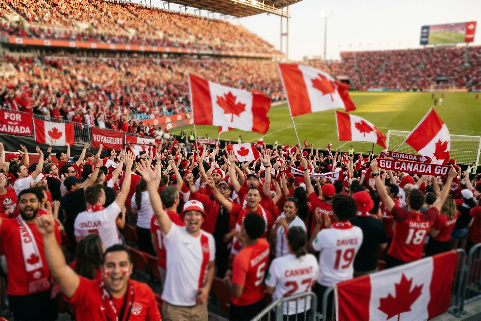 Canadian soccer fans in red and white jerseys cheering inside a packed stadium with maple leaf flags waving